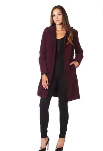 Woman wearing a burgundy coat