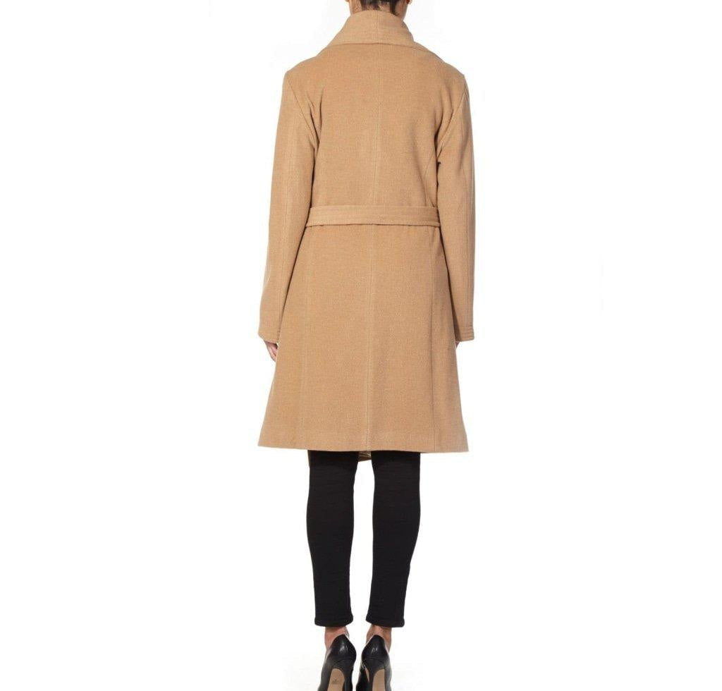 Person wearing a beige coat on a white background.