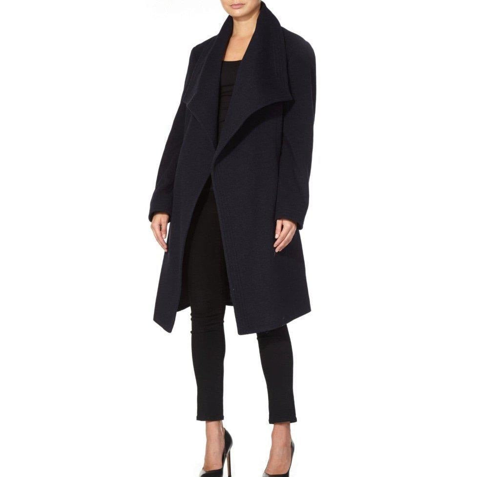 Person wearing a black coat on a white background