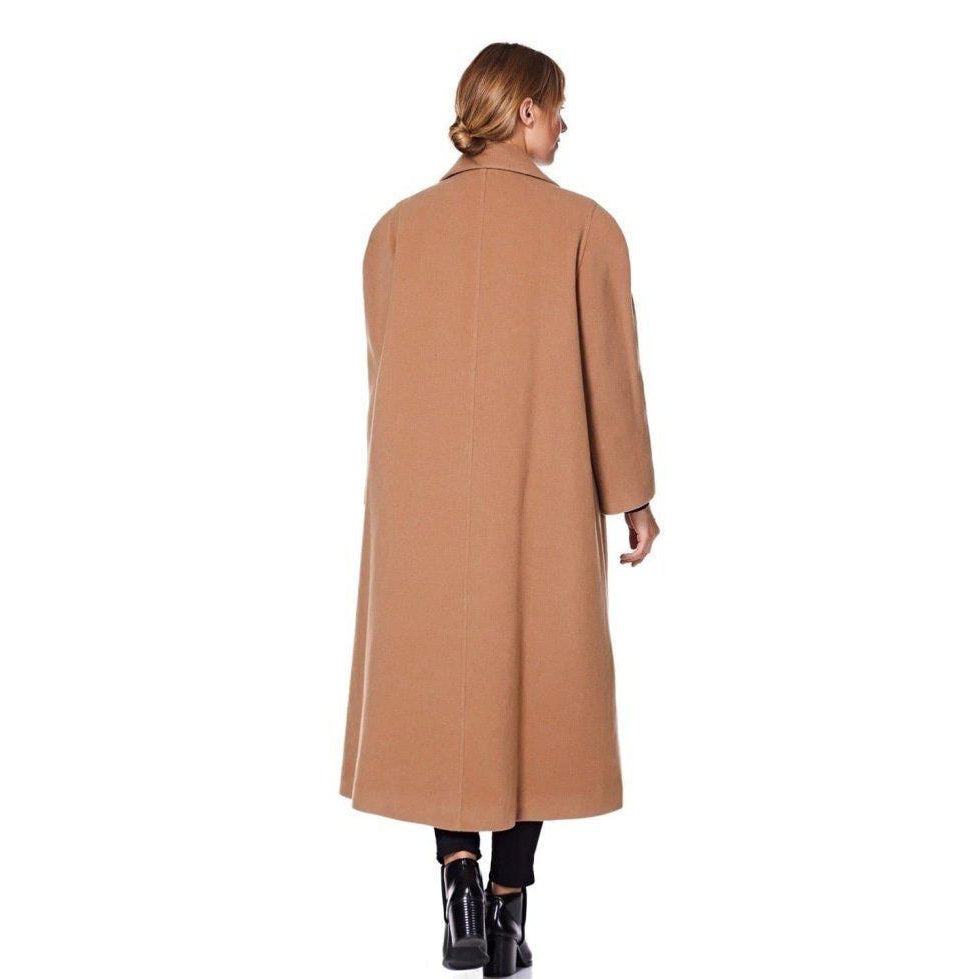 Woman wearing a long beige coat on a white background