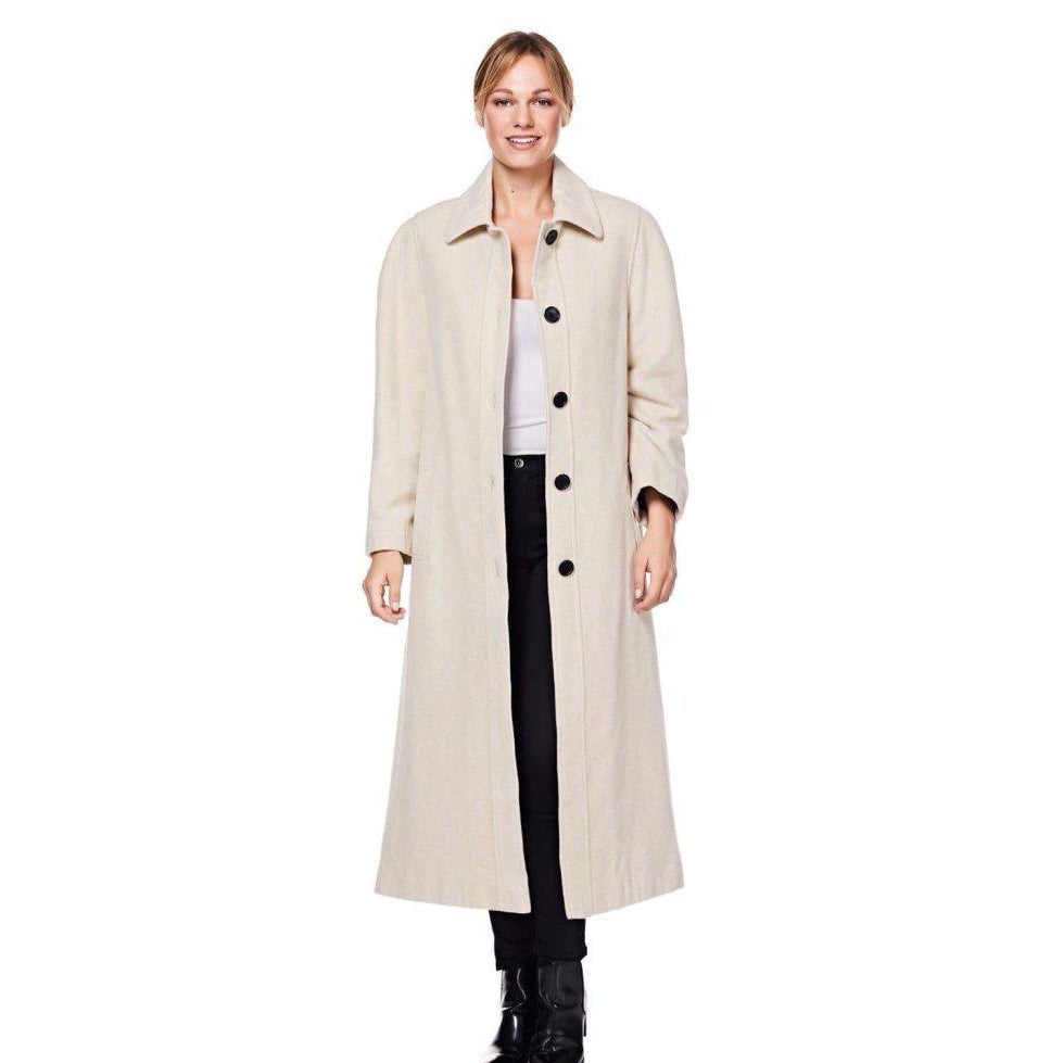 Woman wearing a beige trench coat on a white background