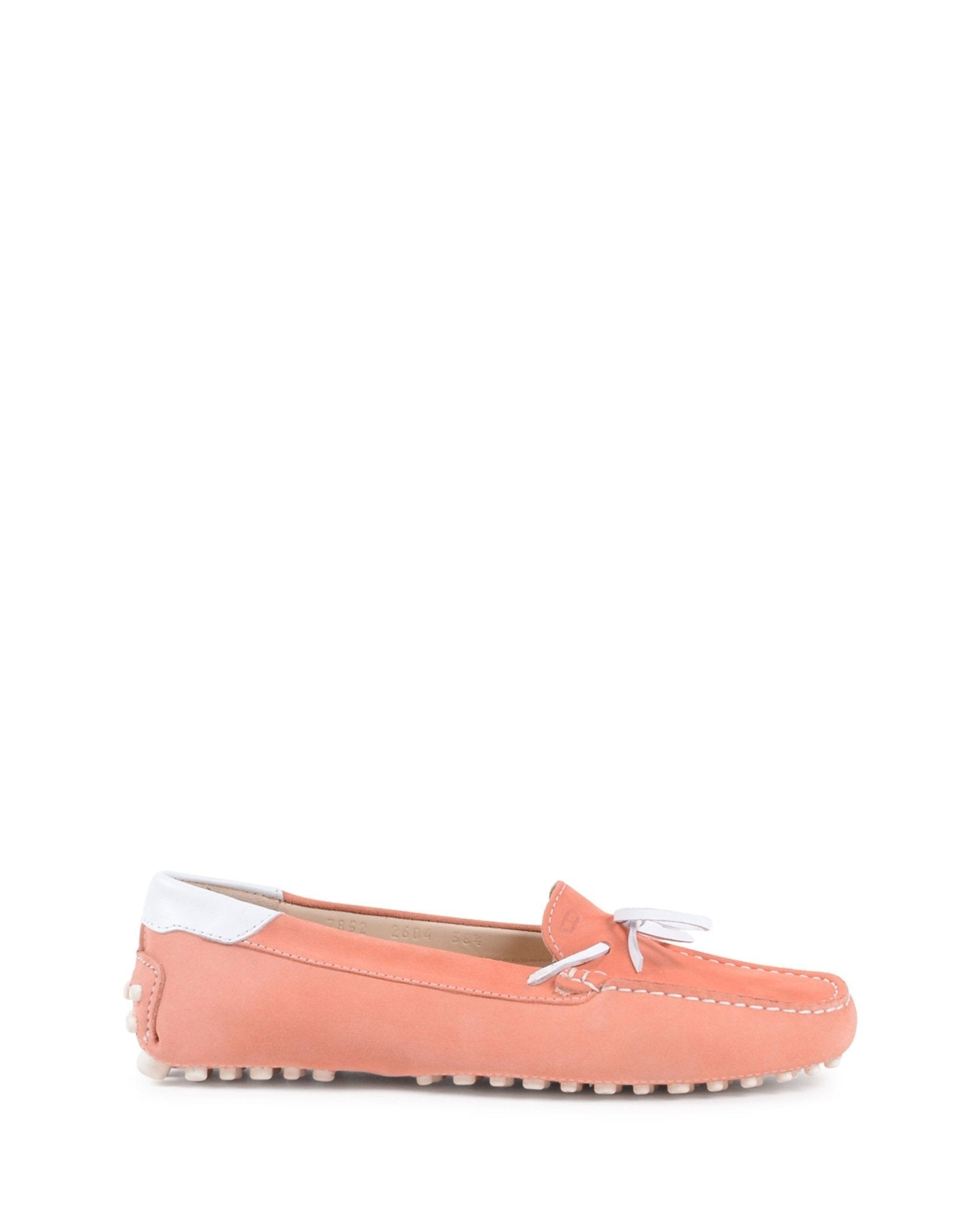 Coral loafers with white accents on a white background
