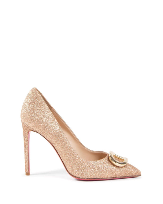 Gold glitter high heel shoe with a red sole on a white background
