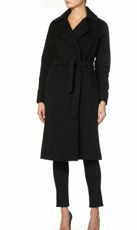 Black coat worn by a model on a white background