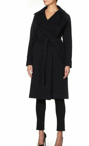 Black coat worn by a model on a white background