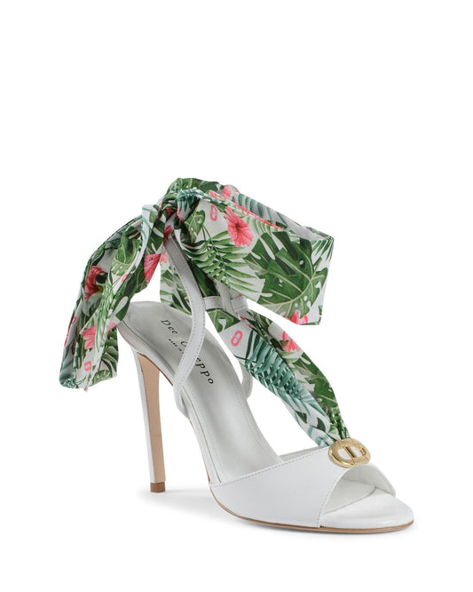 White high-heeled shoe with floral ribbon on a white background