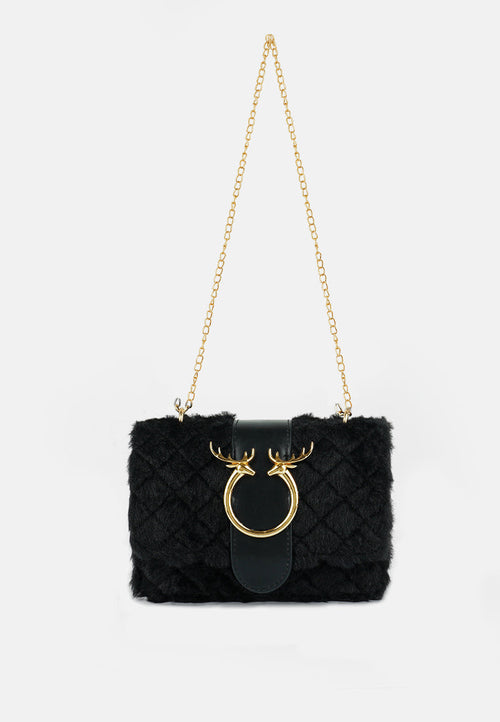 Black fur handbag with gold chain and deer head design on a white background