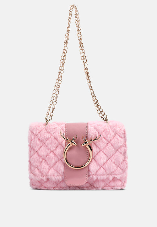 Pink quilted handbag with gold chain strap on a white background