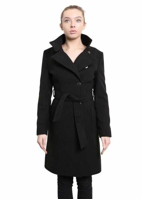 Woman wearing a black coat on a white background