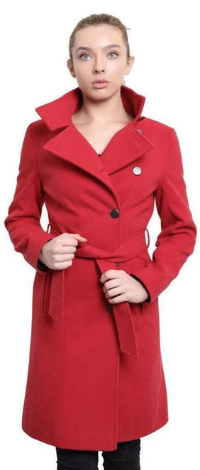 Woman wearing a red coat with a white background