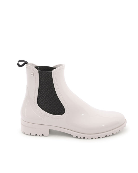 White Chelsea rain boot with black elastic side on a white background