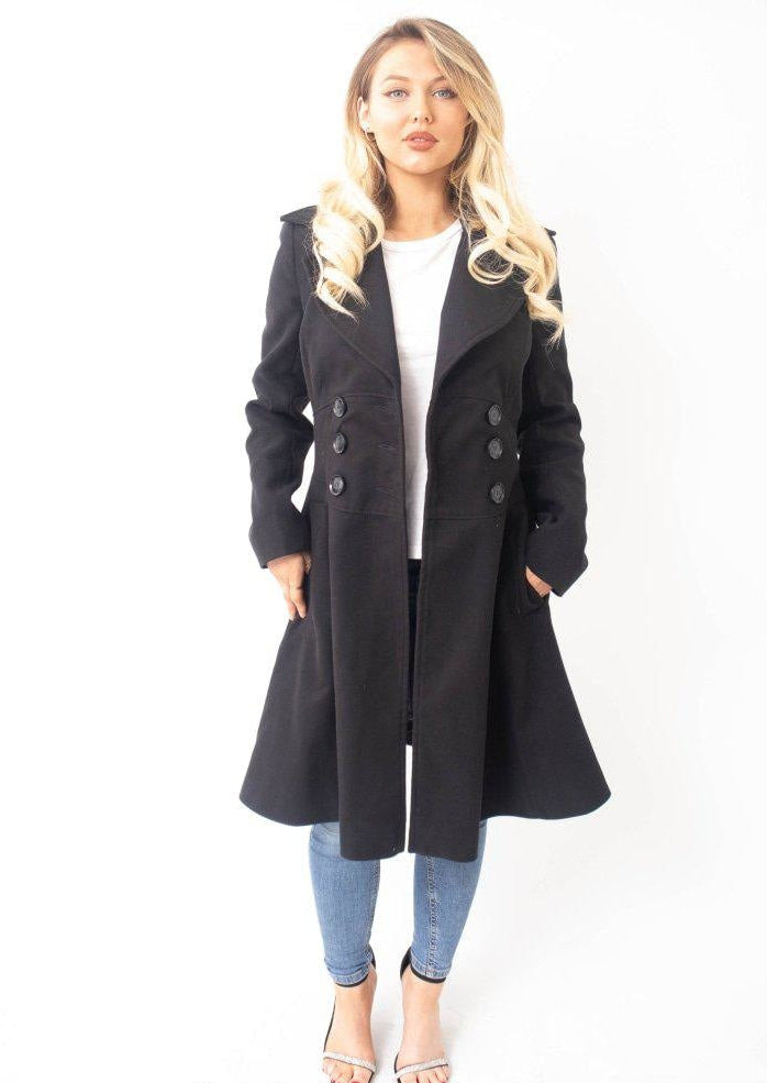 Woman wearing a black coat on a white background