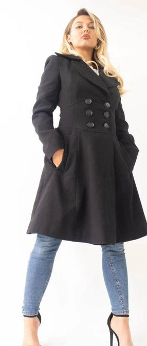 Woman wearing a black coat with a white background