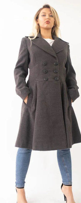 Woman wearing a gray coat with a white background