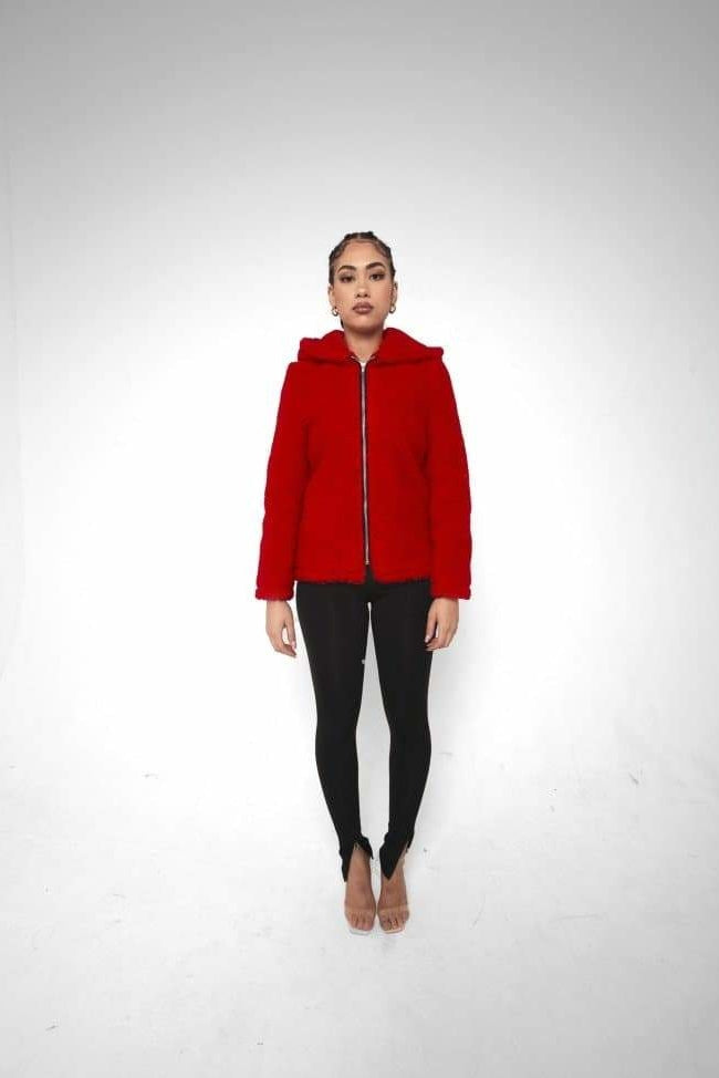 Person wearing a red jacket on a white background