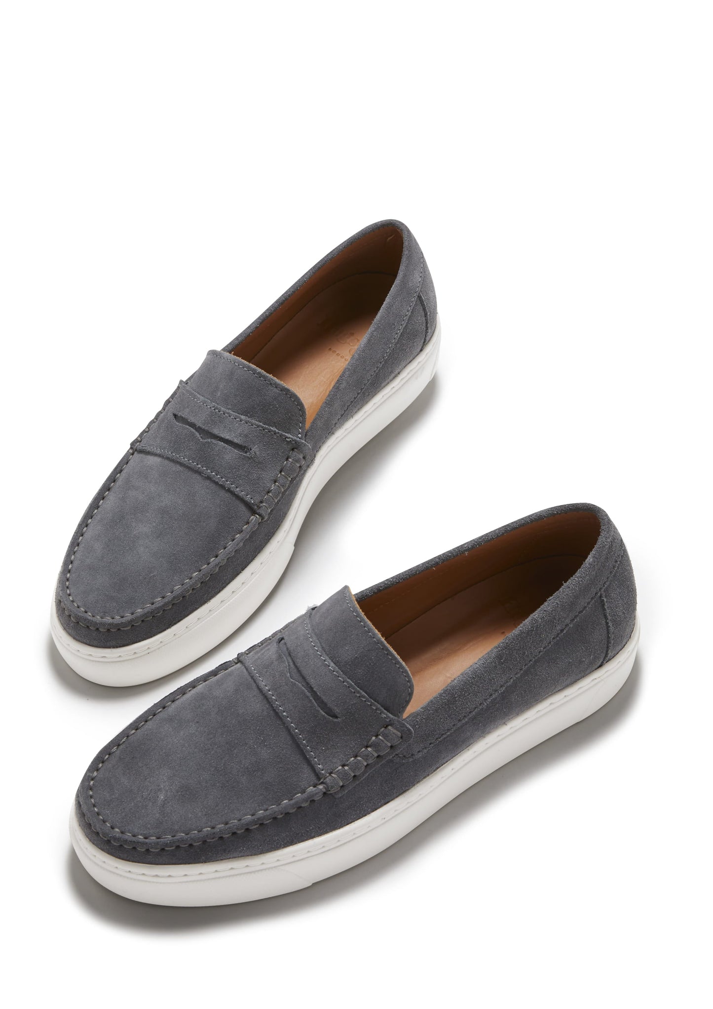 Pair of gray loafers with white soles on a white background