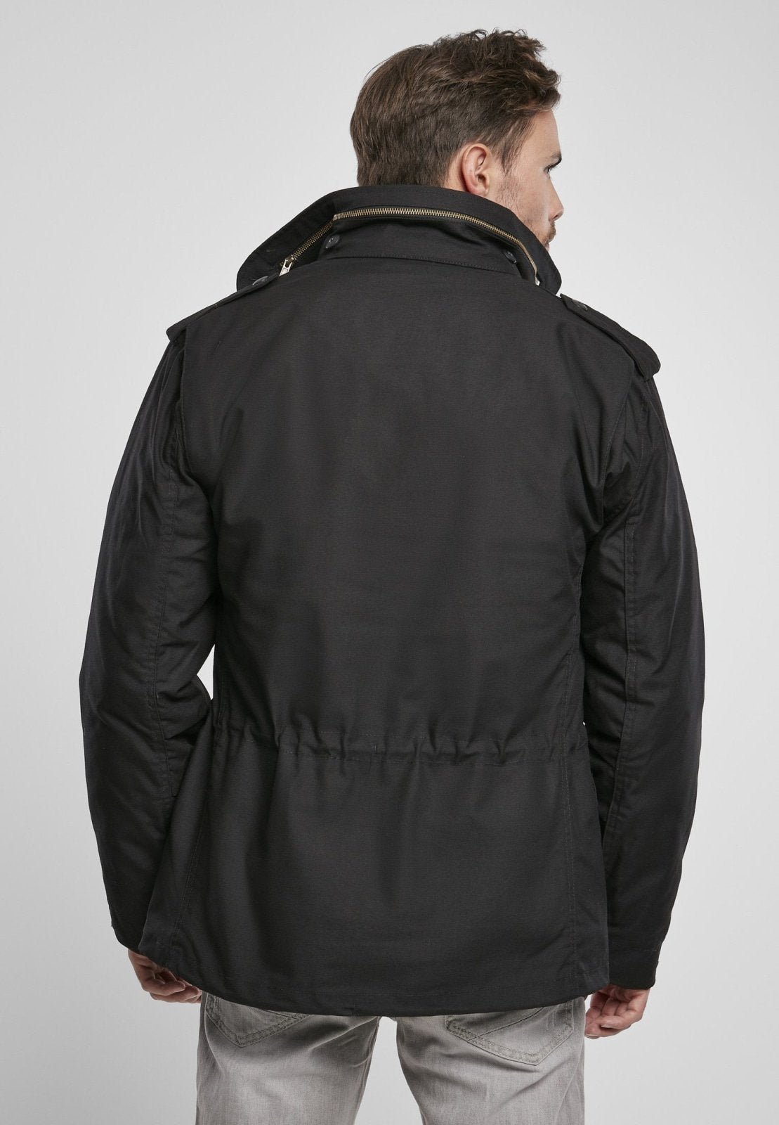 Man wearing a black jacket on a white background