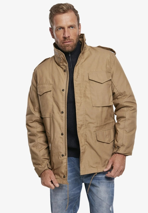 Man wearing a brown jacket on a white background