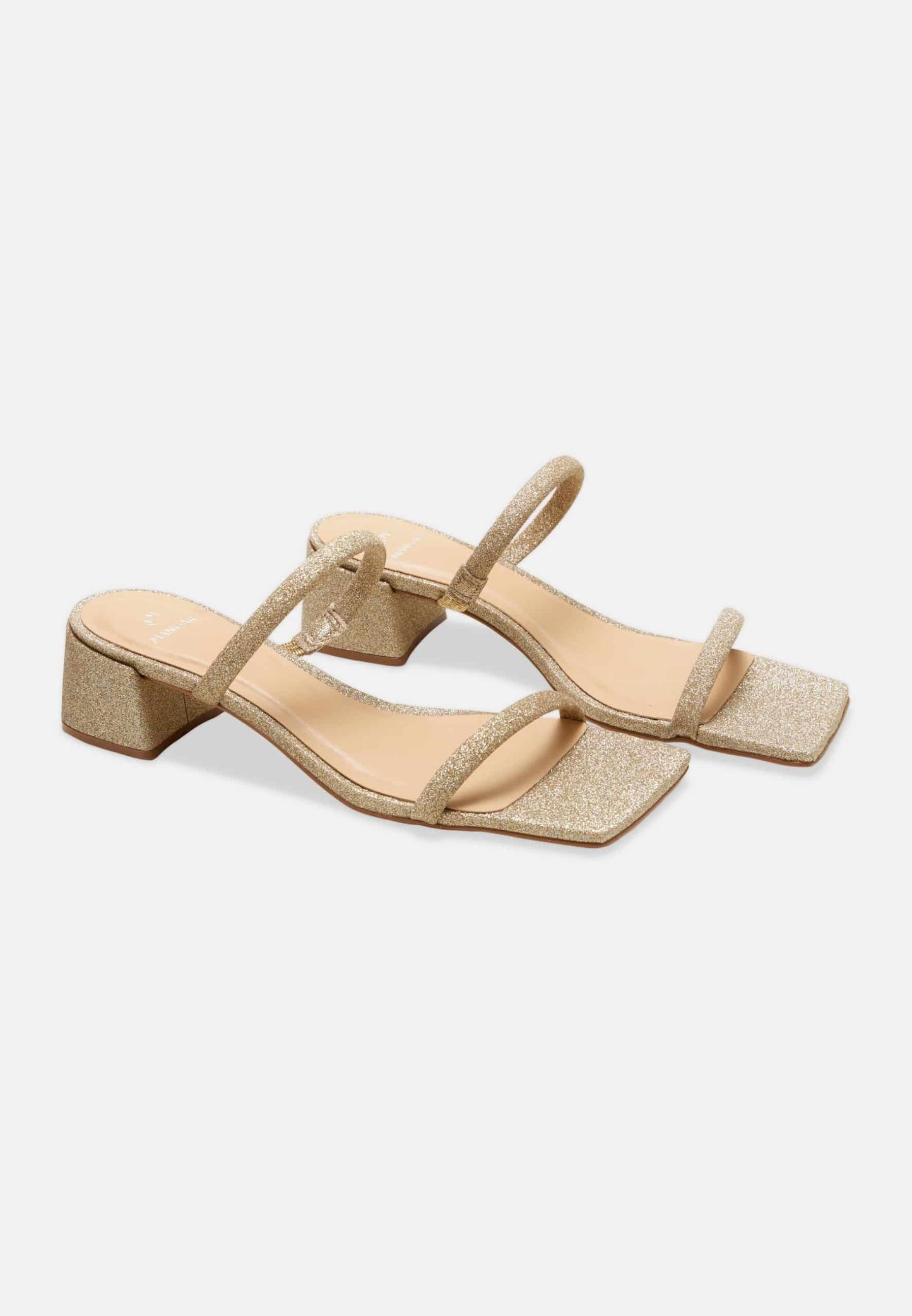 Beige sandals with thin straps on a white background