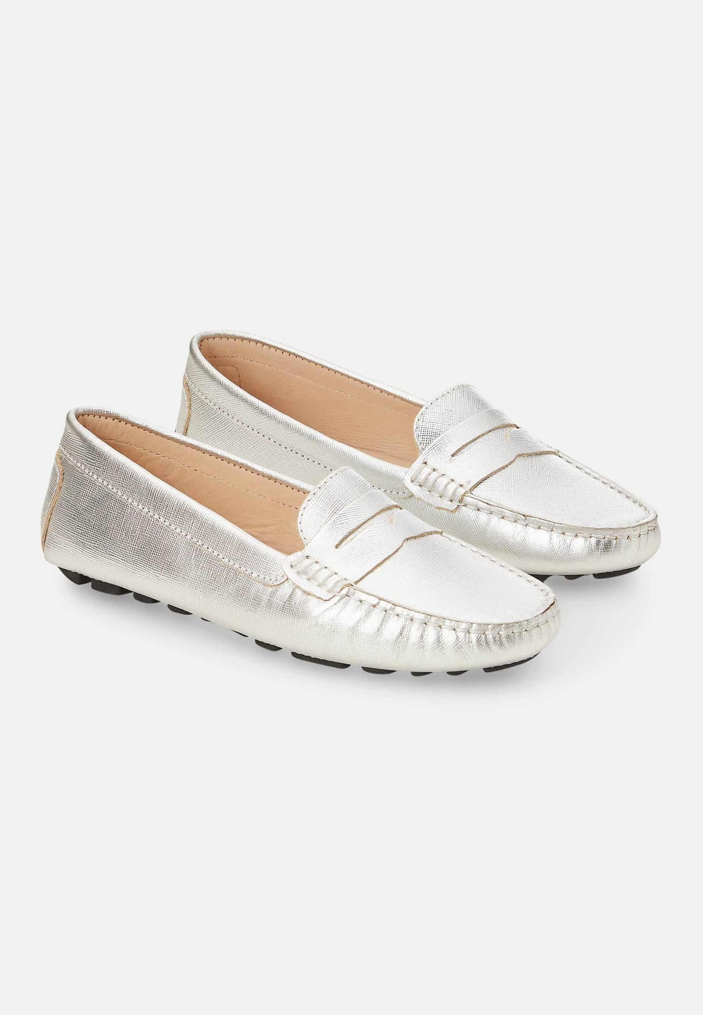 Pair of silver loafers on a white background