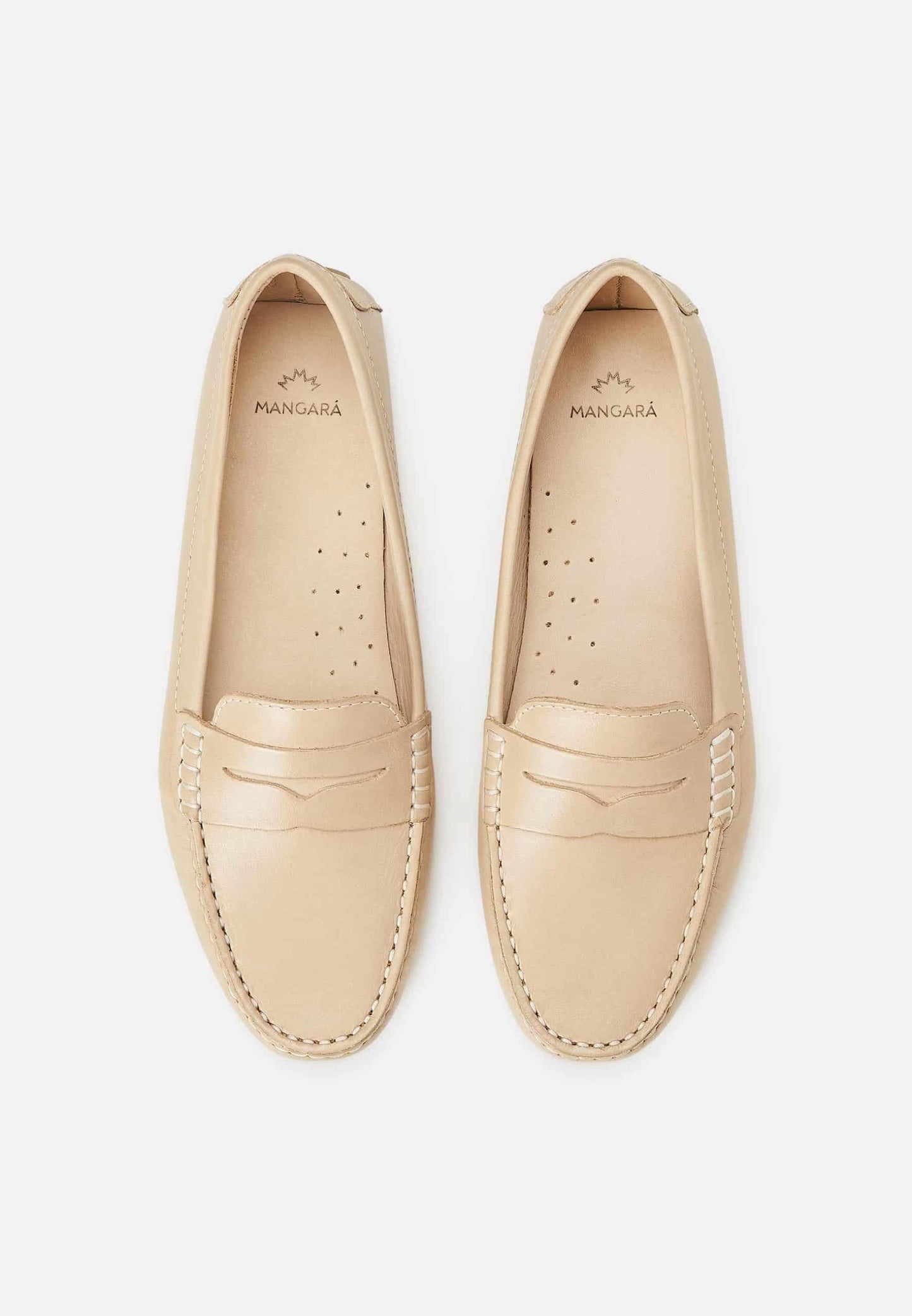 Pair of beige loafers on a white background