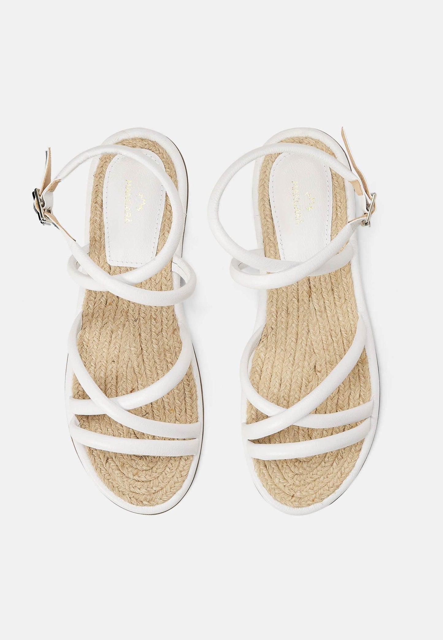 White sandals with jute straps on a white background
