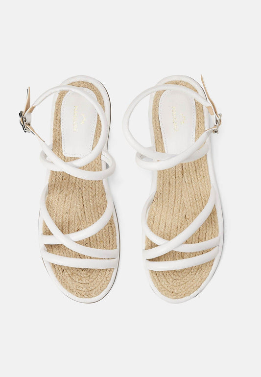 White sandals with jute straps on a white background