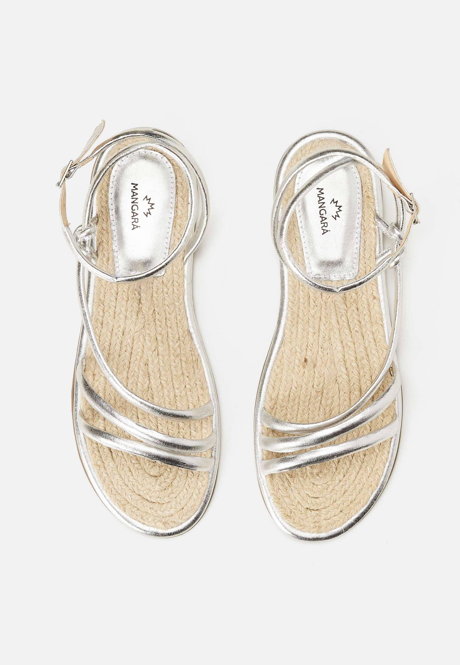 Silver sandals with jute sole on a white background
