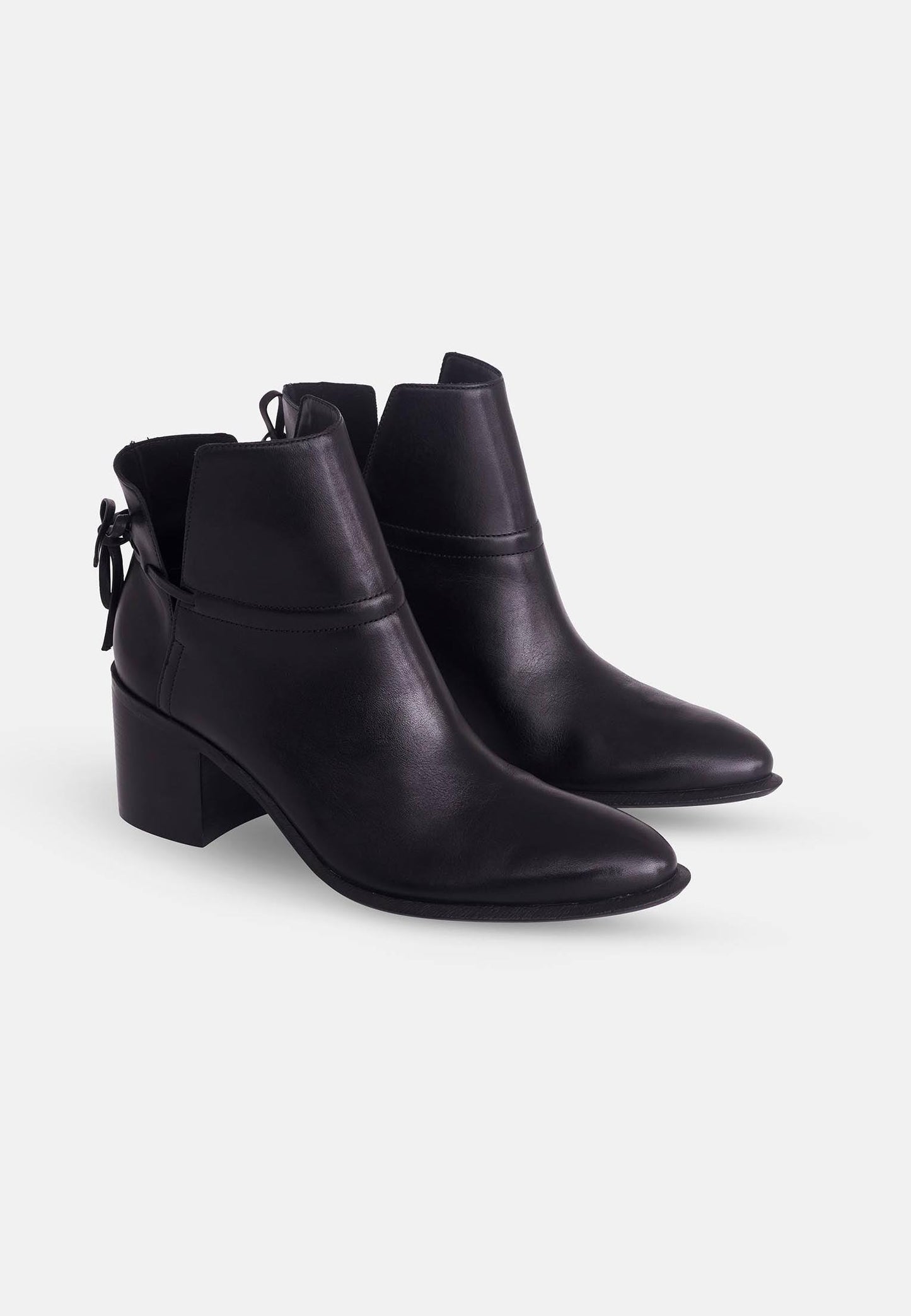 Pair of black ankle boots on a white background
