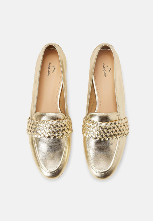 Pair of gold loafers with woven detail on a white background
