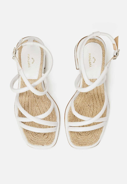 White sandals with woven sole on a white background