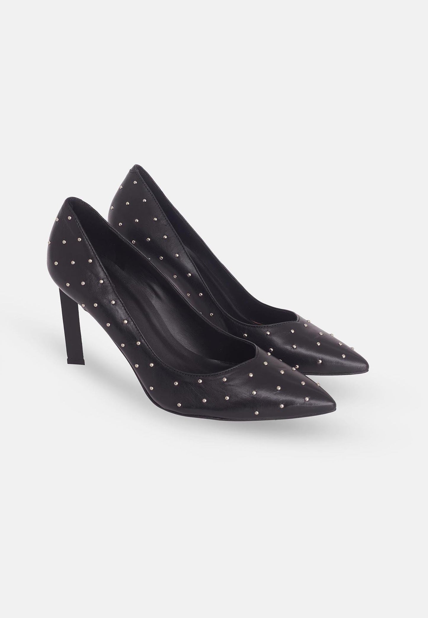 Black high-heeled shoes with studded details on a white background