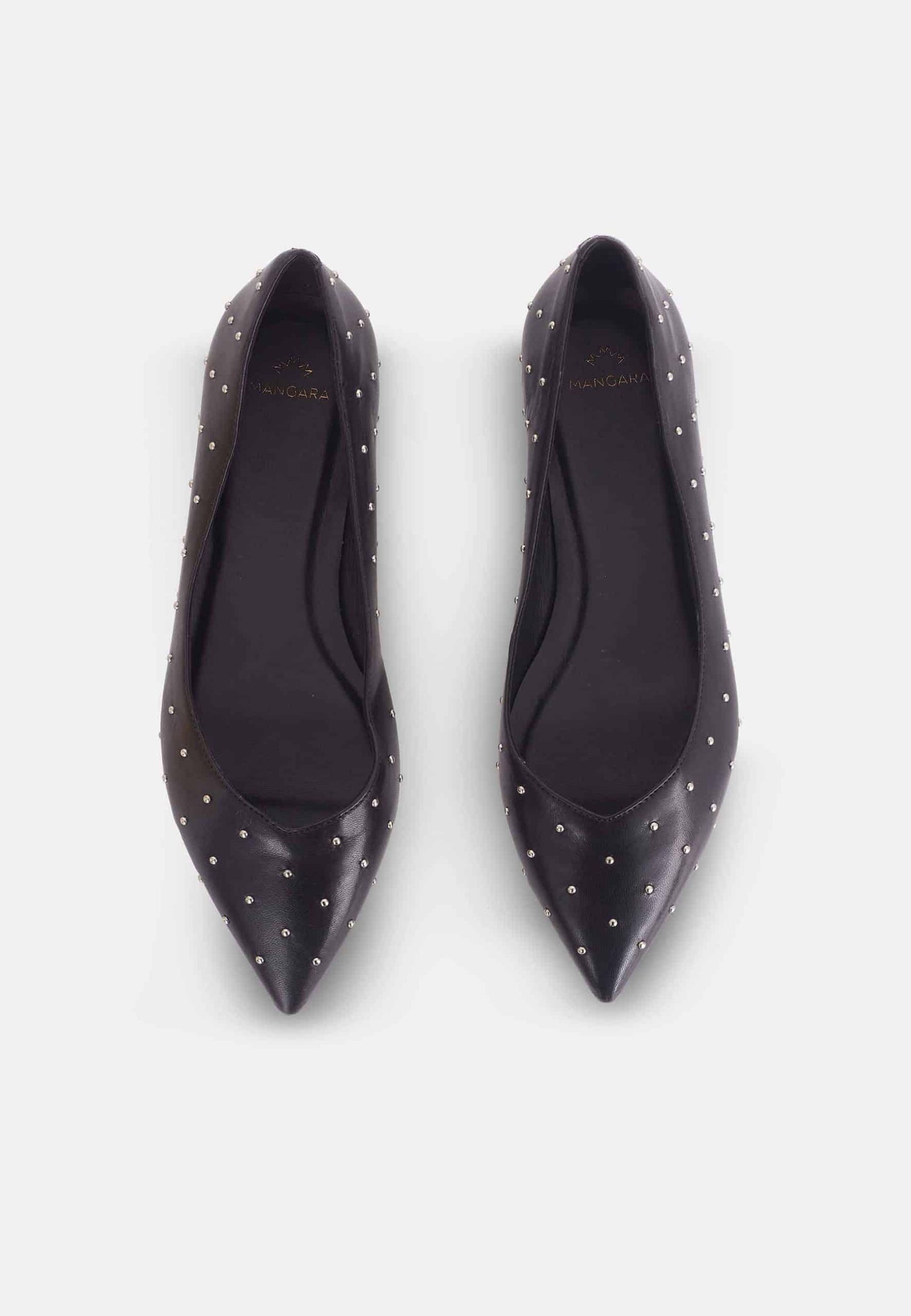 Pair of black pointed-toe shoes with studded details on a white background