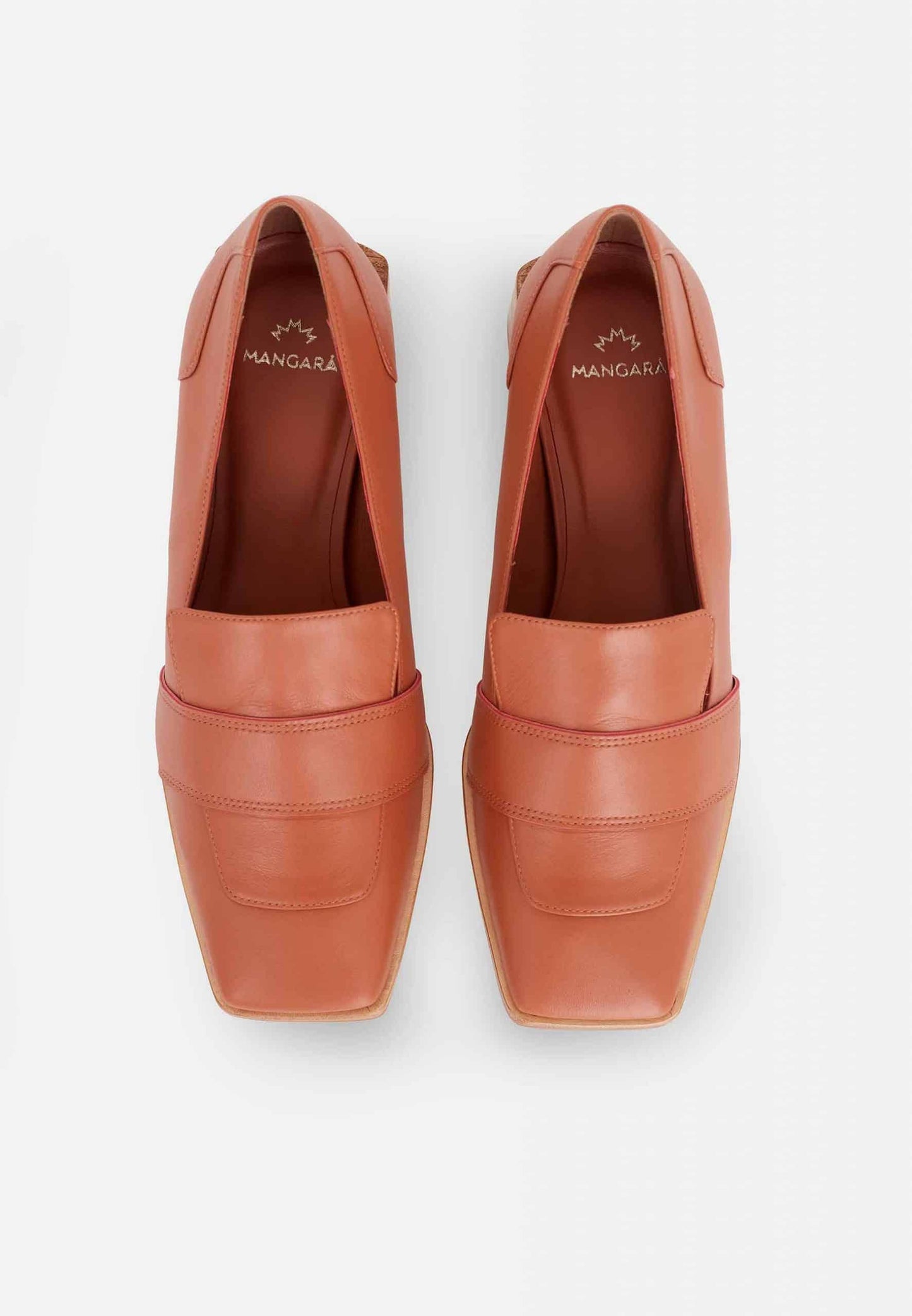 Pair of brown loafers on a white background