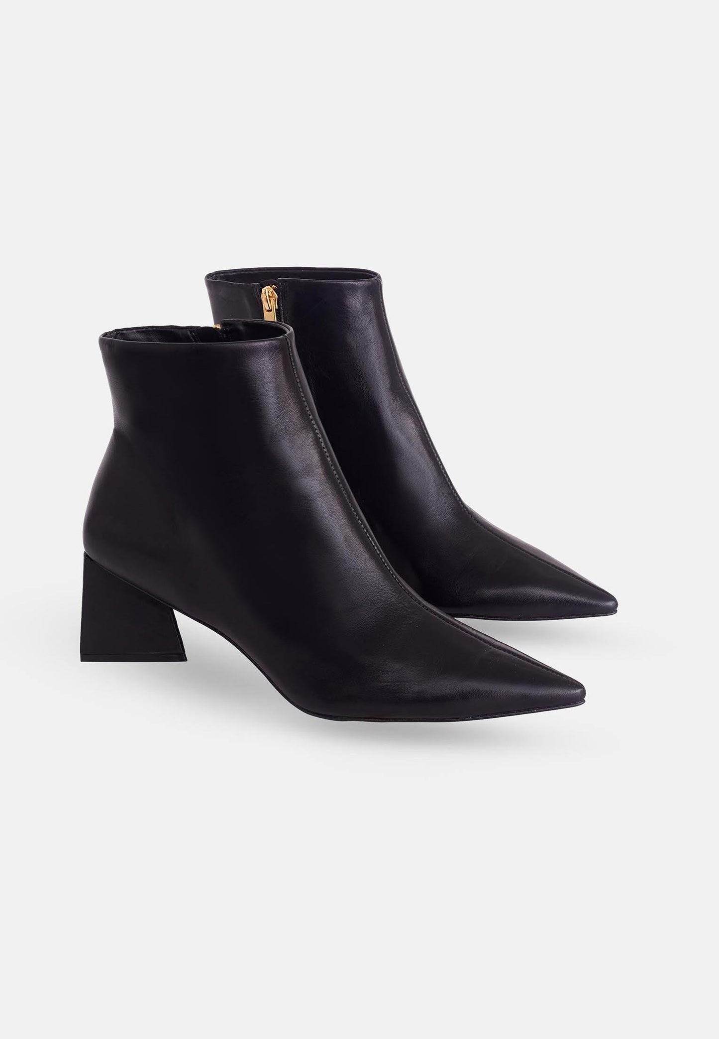 Pair of black ankle boots with a block heel on a white background