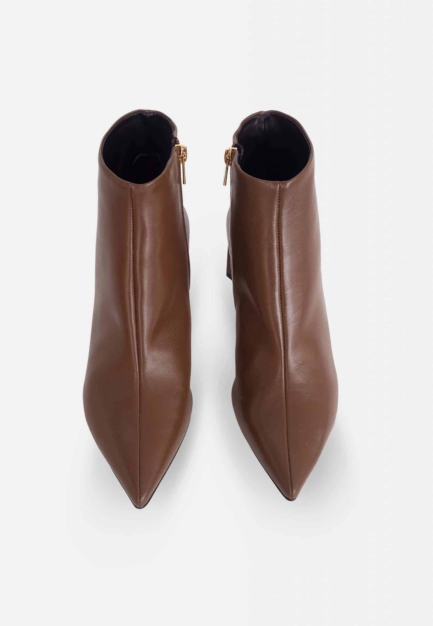 Pair of brown ankle boots on a white background