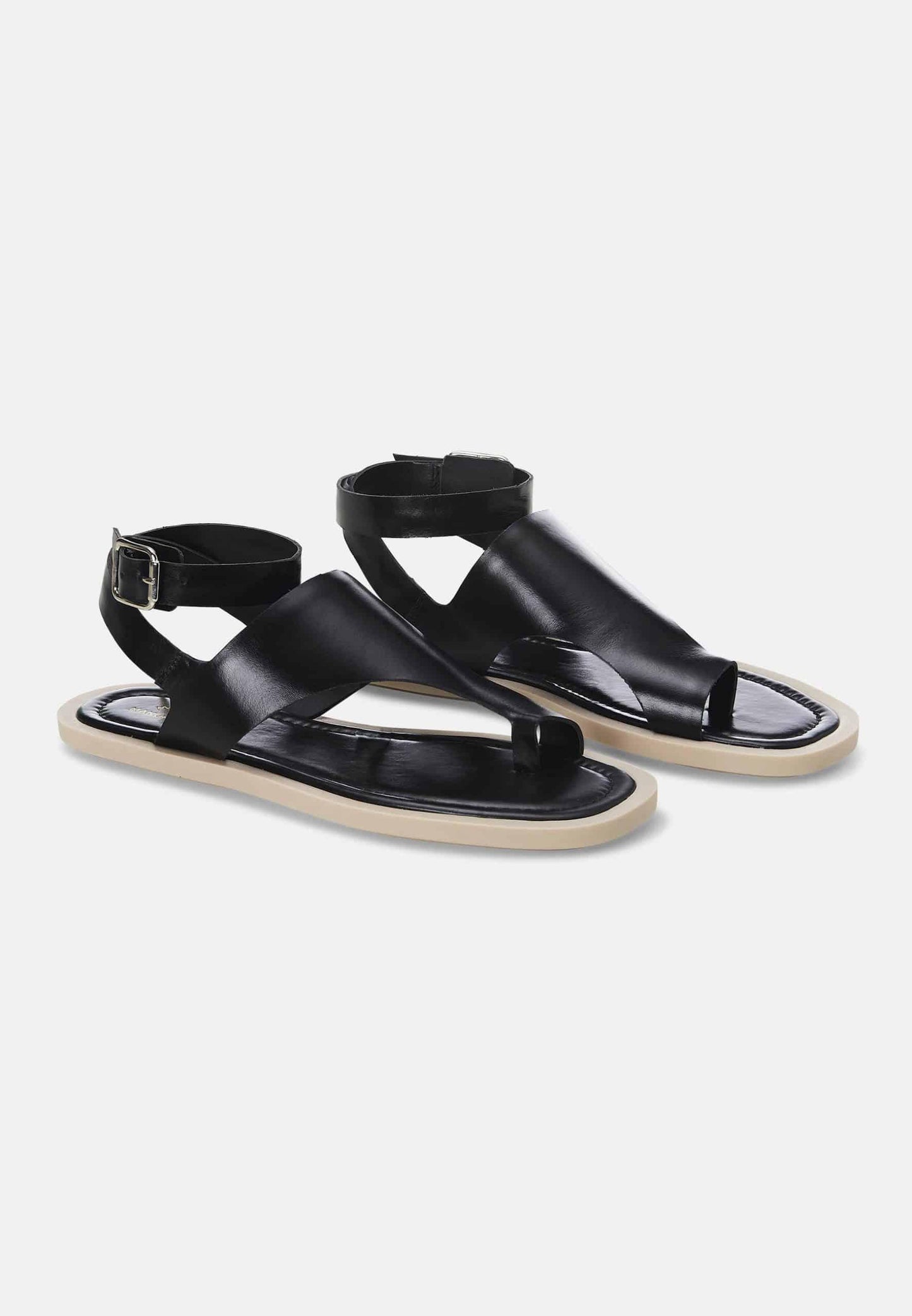 Pair of black sandals on a white background