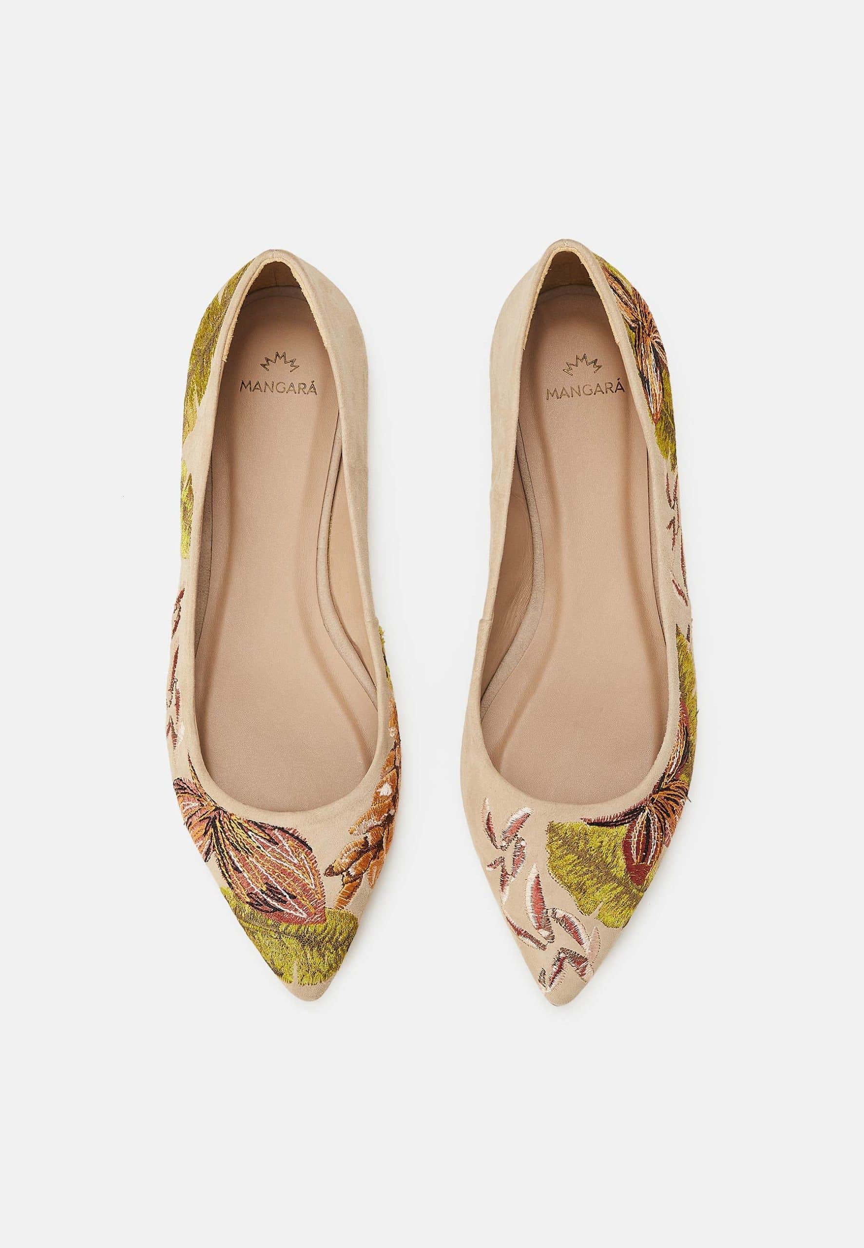 Pair of floral-patterned flats on a light gray background