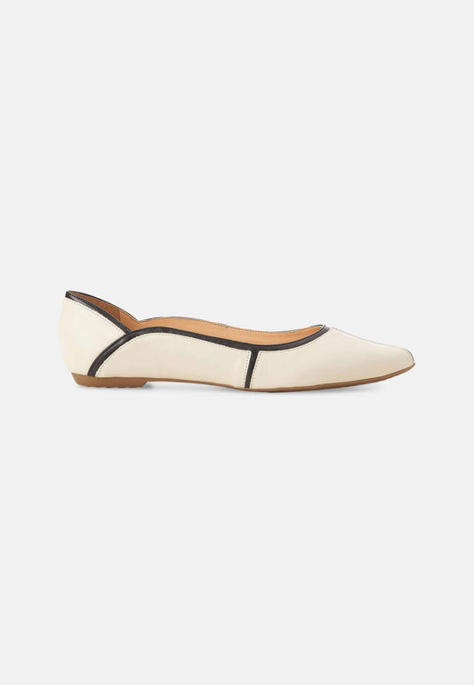 White flat shoe with brown accents on a white background