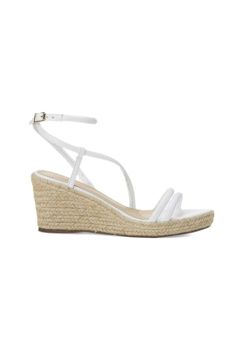 White wedge sandal with espadrille sole on a white background