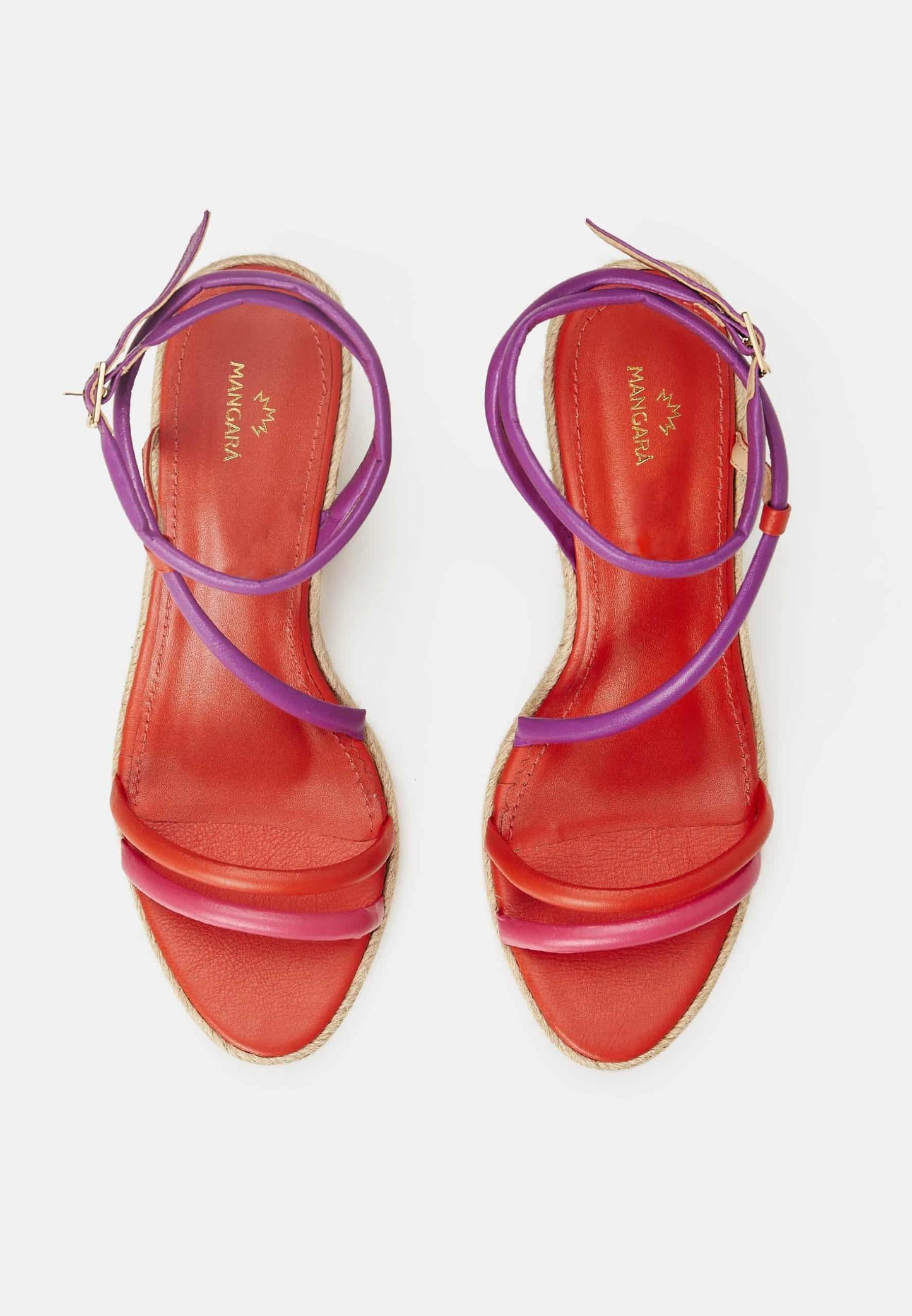 Red sandals with purple straps on a white background