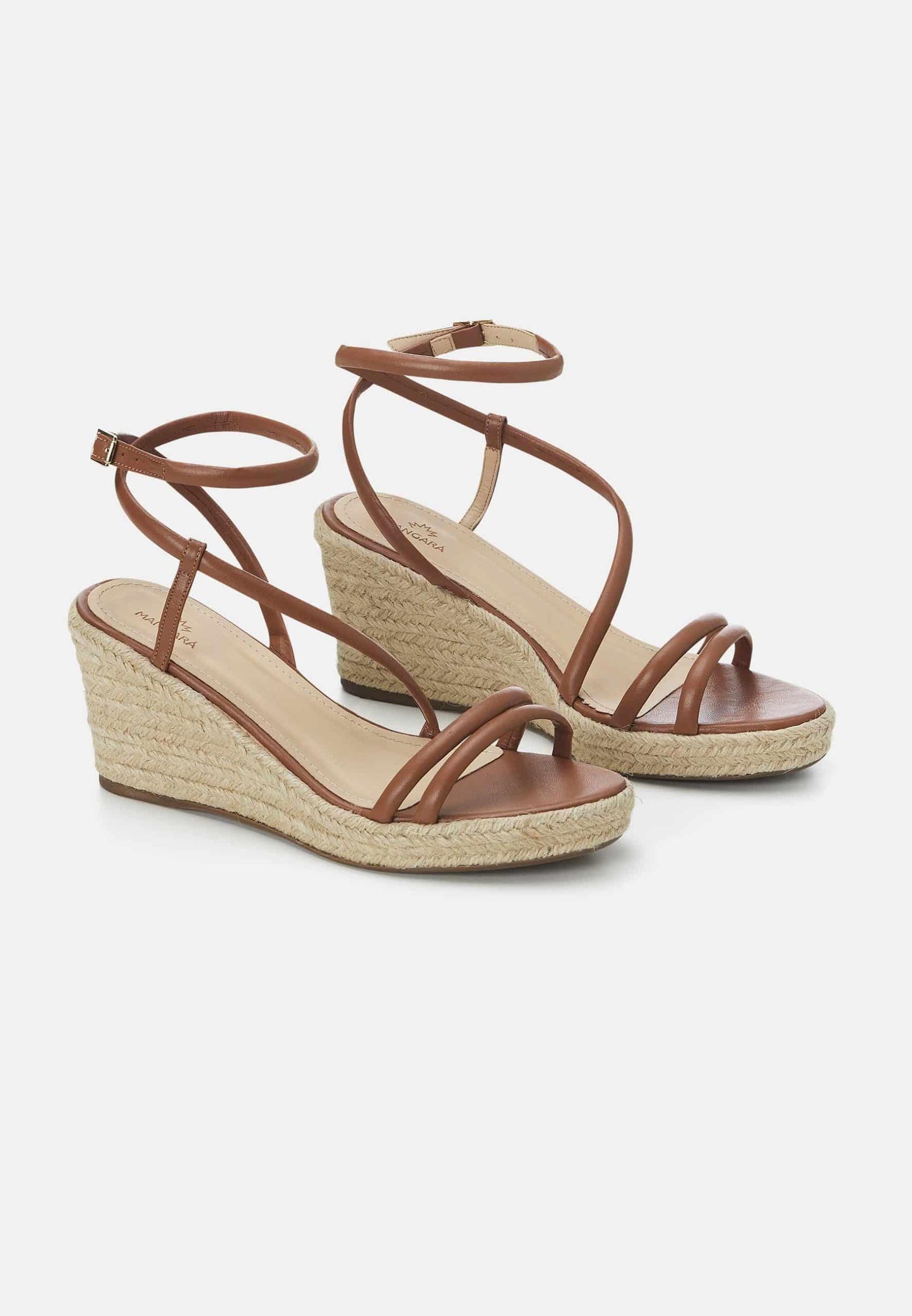 Brown wedge sandals with espadrille sole on a white background