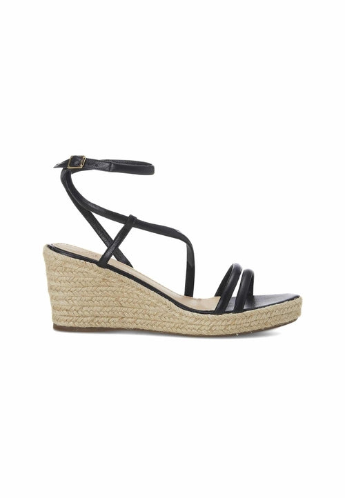 Black wedge sandal with espadrille sole on a white background
