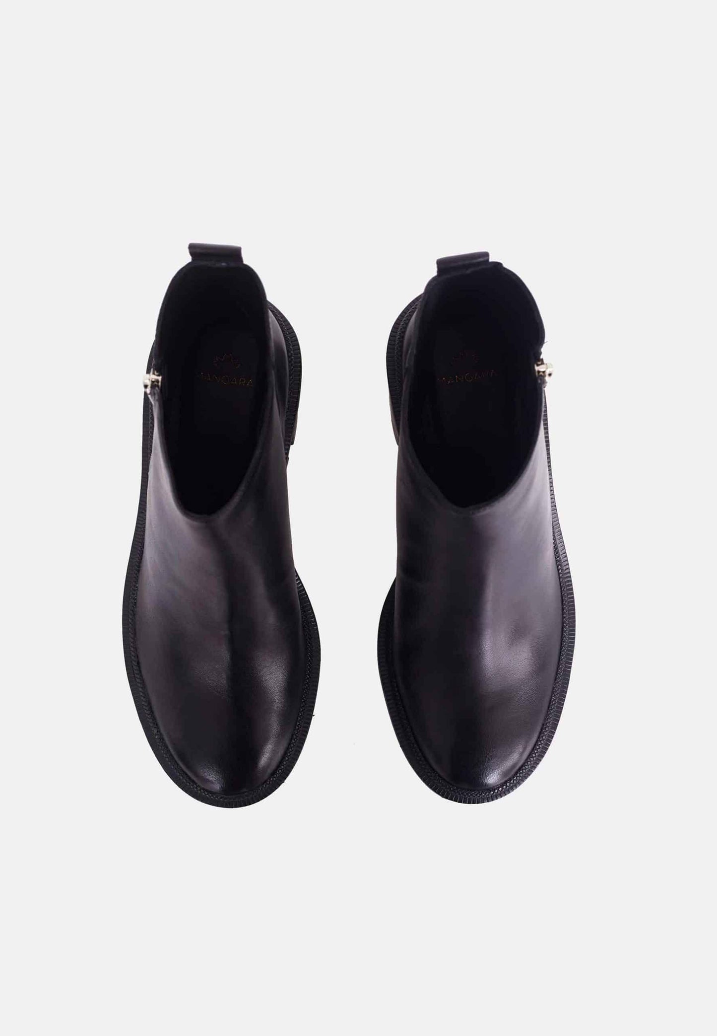 Pair of black ankle boots on a white background