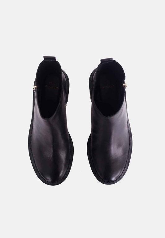 Pair of black ankle boots on a white background