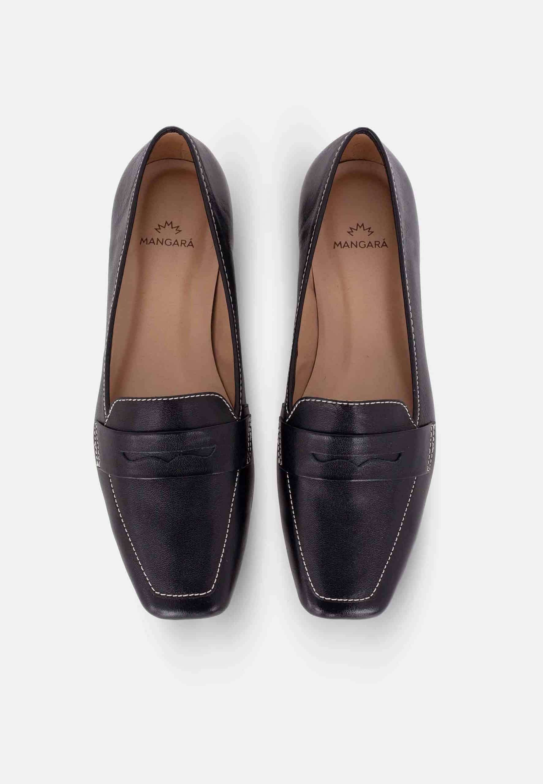 Pair of black loafers with branding on a white background