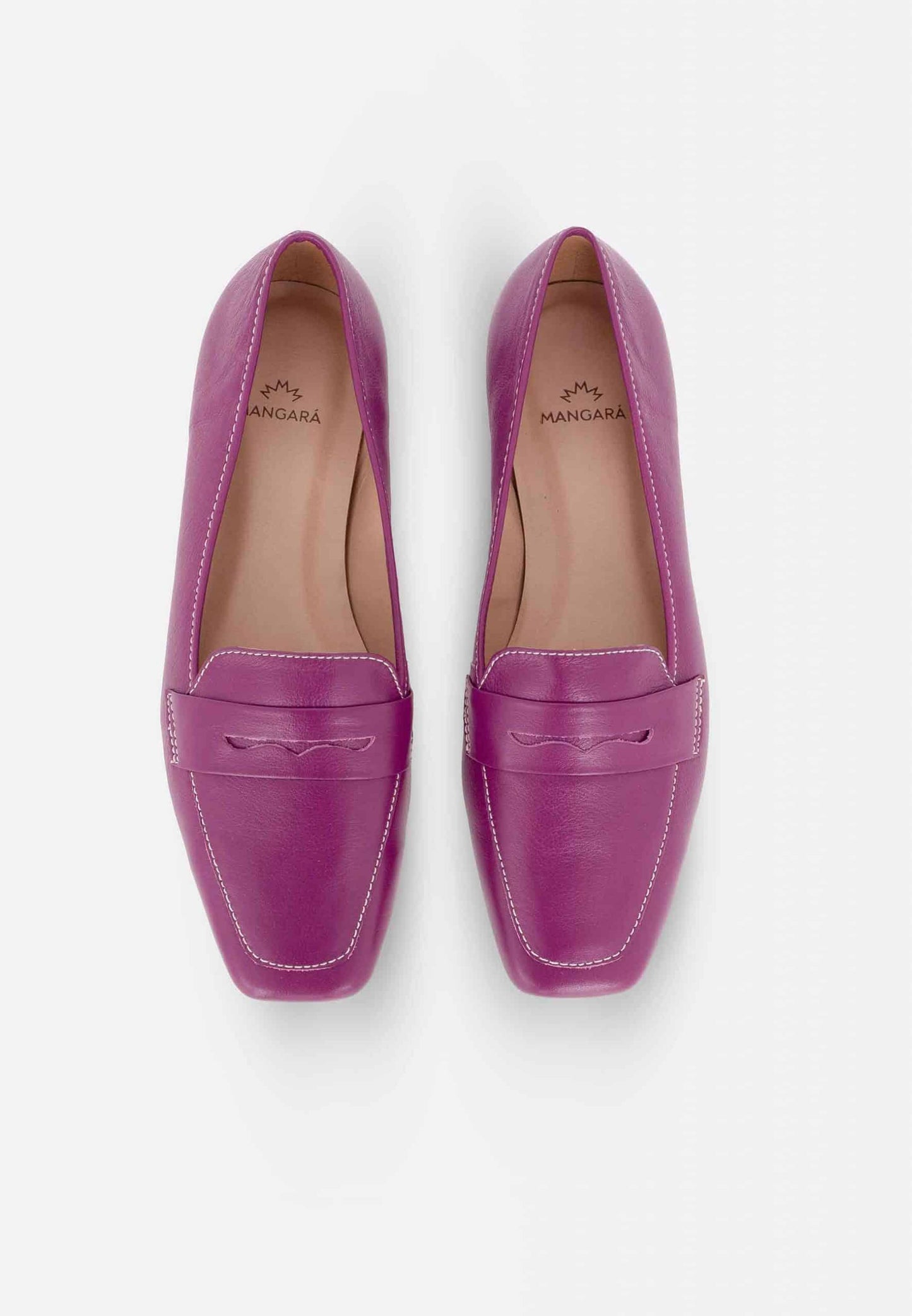 Pair of purple loafers on a white background