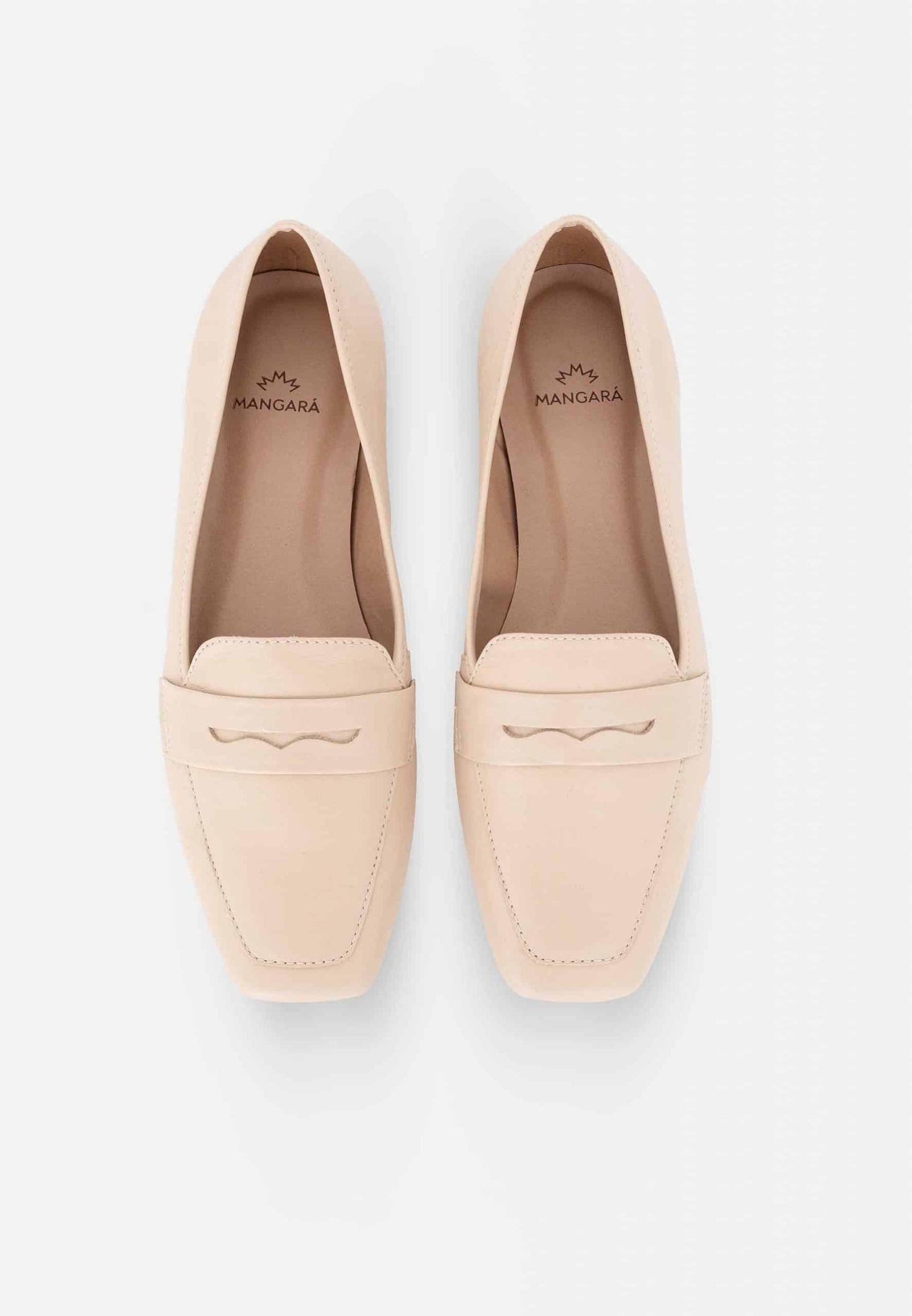 Pair of beige loafers on a light gray background