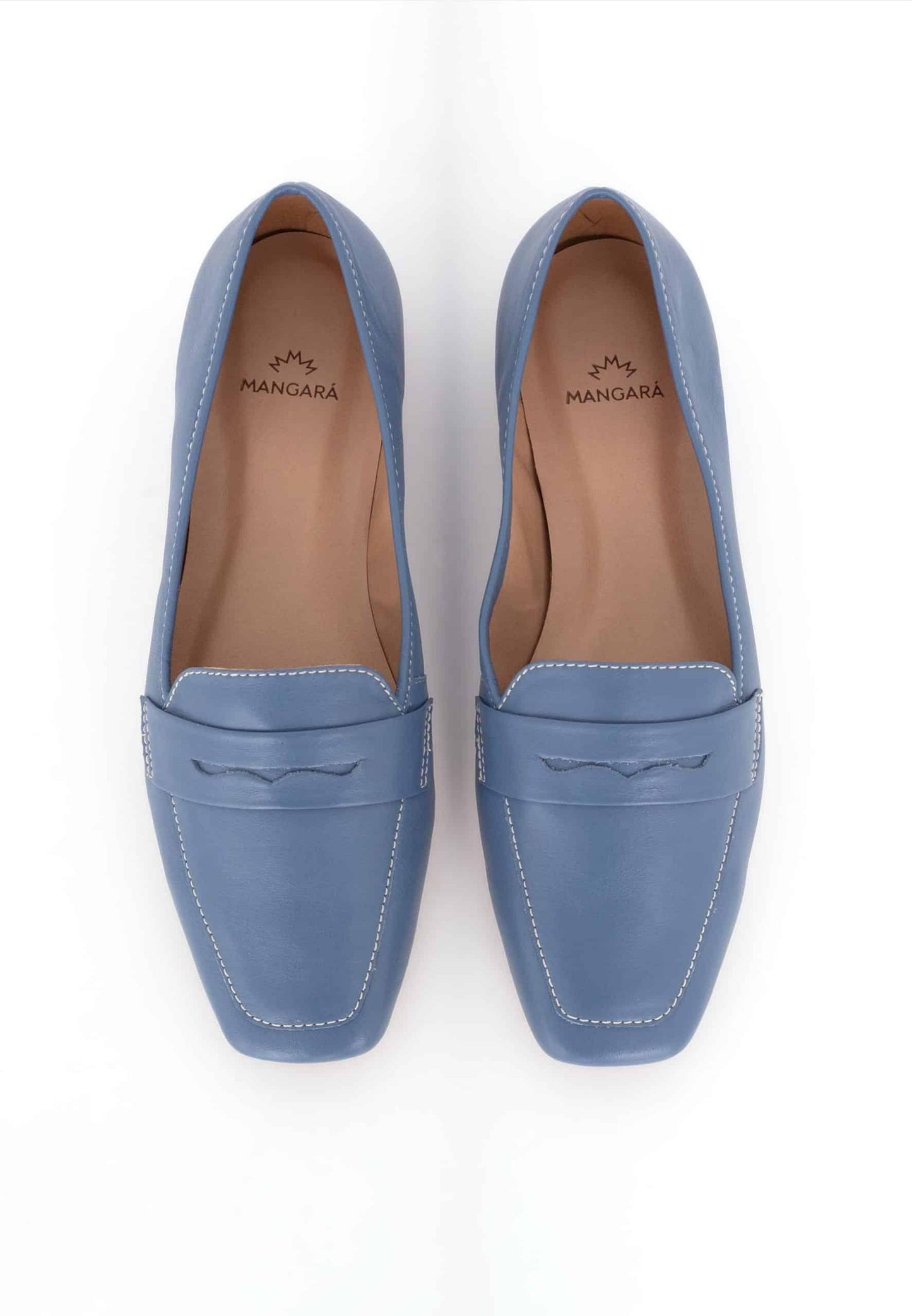 Pair of blue loafers on a white background