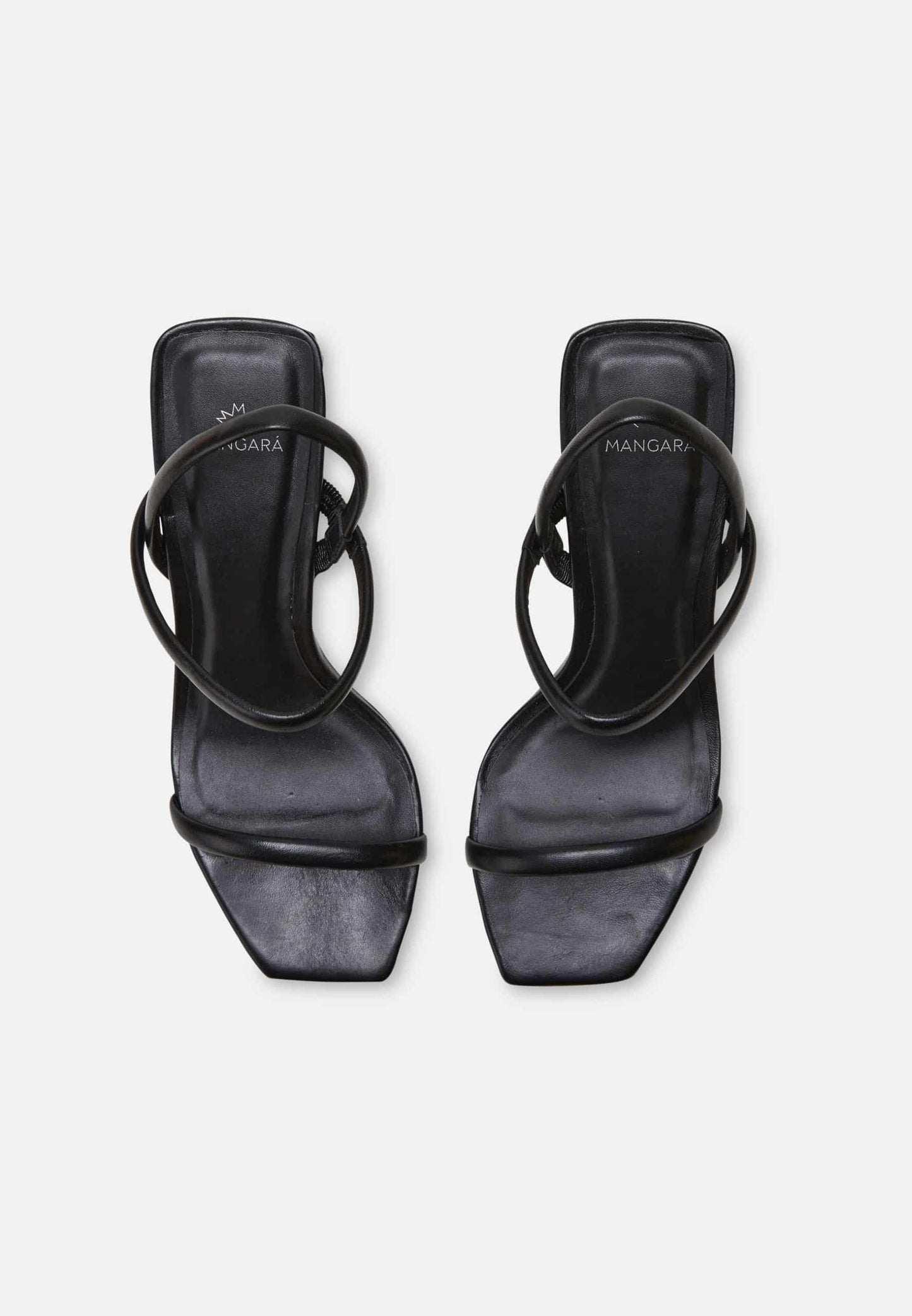 Black high-heeled sandals with strappy design on a white background